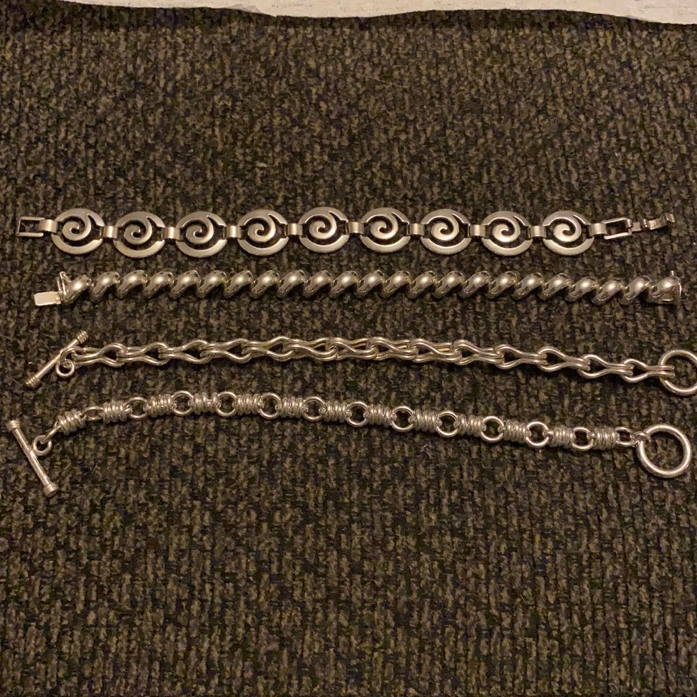 Four silver bracelets
